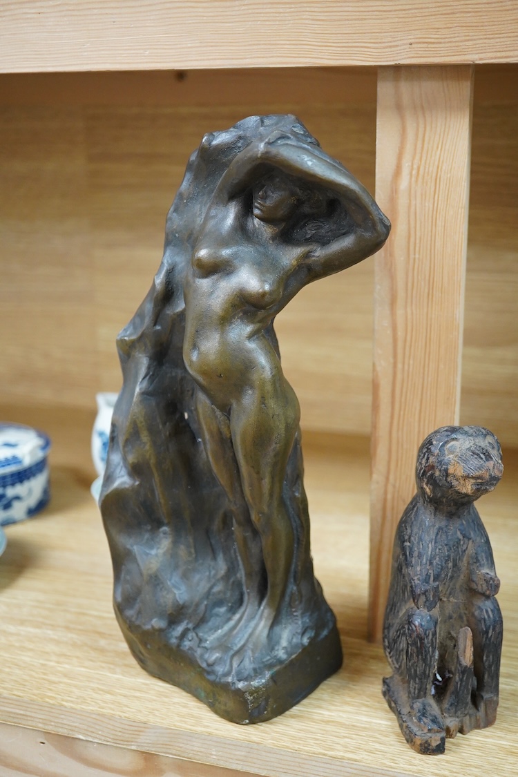 A contemporary bronze figure of a standing female nude, indistinctly signed and a card wood figure of a bear, tallest 29.5cm